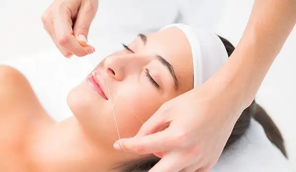 Facial threading around the upper lip