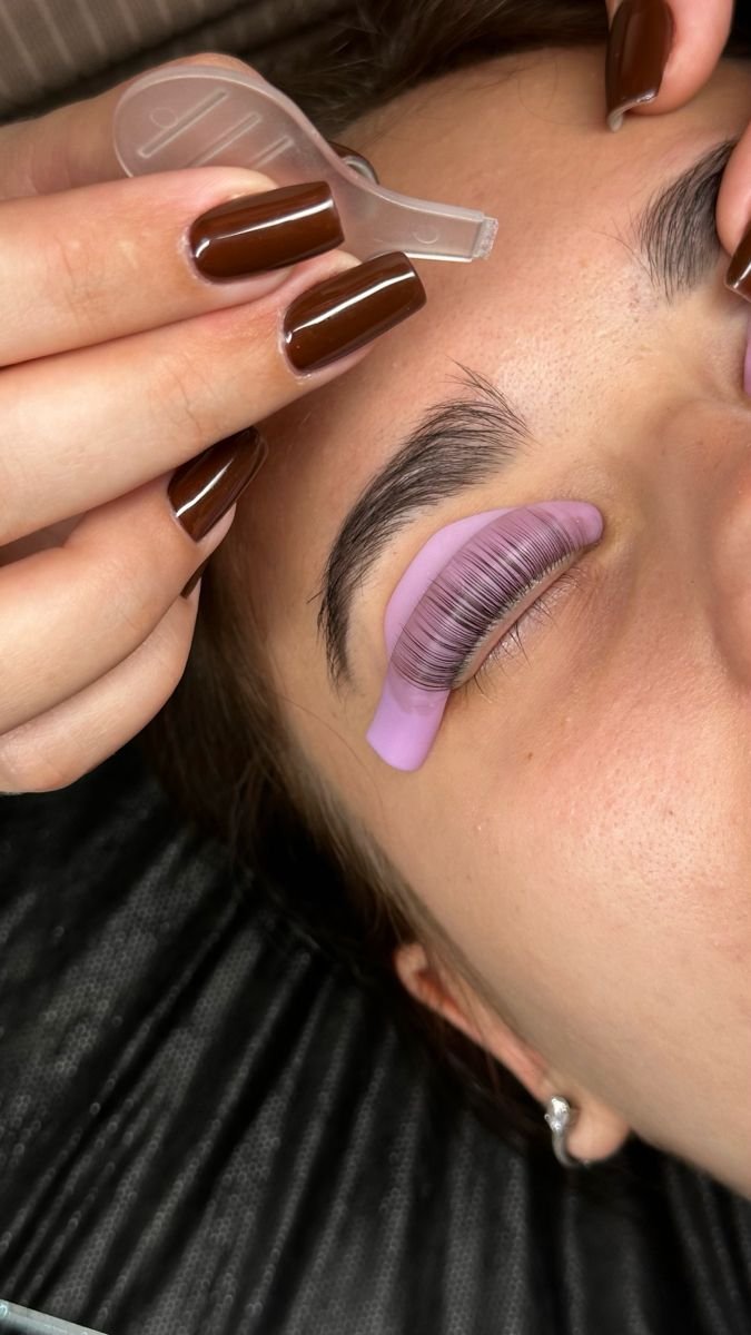 Natural lashes carefully aligned on a lifting shield
